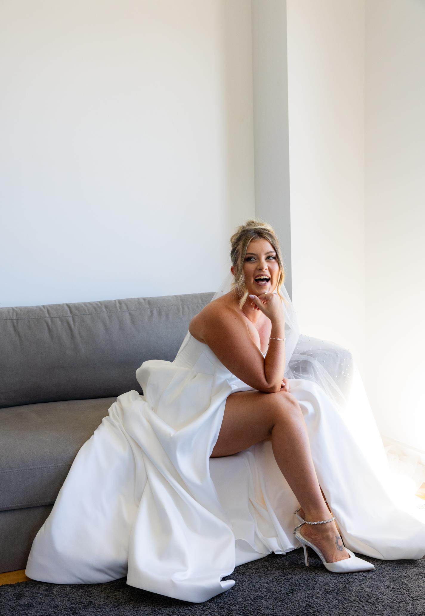 Bride laughing, natural spray tan finish