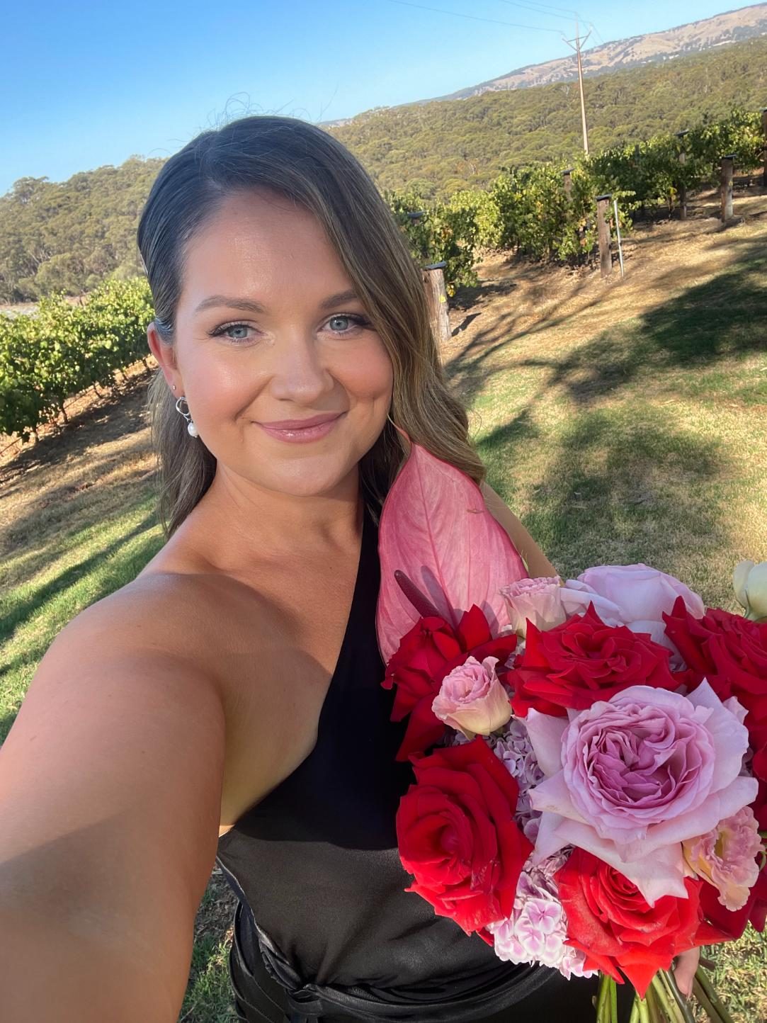 Black formal dress with rose bouquet