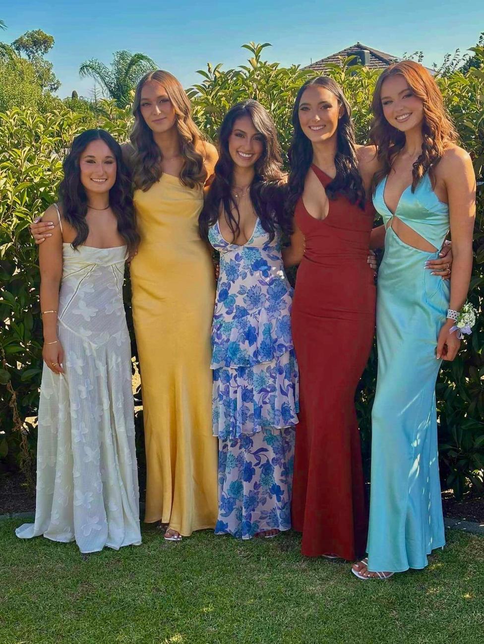 Five friends in formal dresses