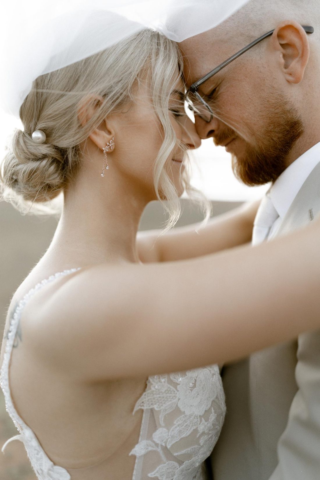 Bride and groom, foreheads together