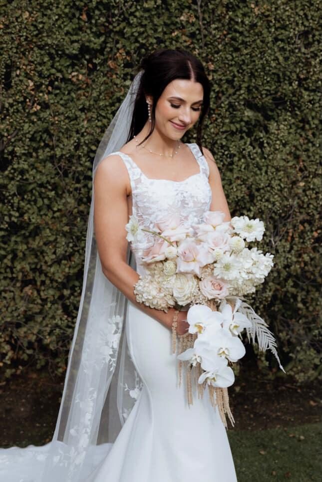 Bridal portrait with veil and blush bouquet